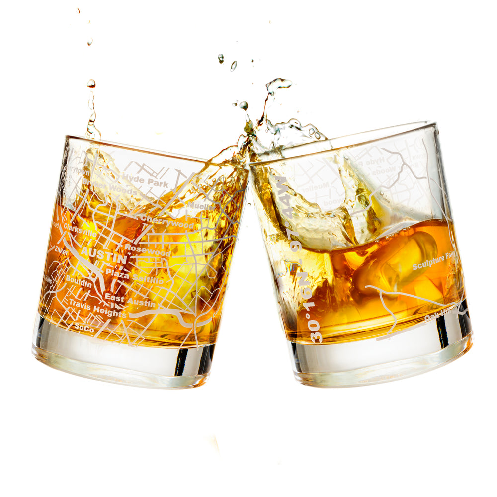 Premium Photo  Glass with whiskey and falling ice cube with splashes